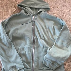 green zip up hoodie